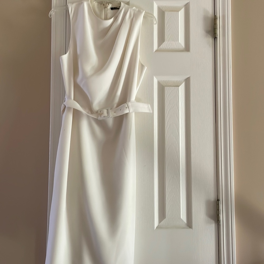 Marciano size small white dress worn once .  Dress is fully lined with belt.